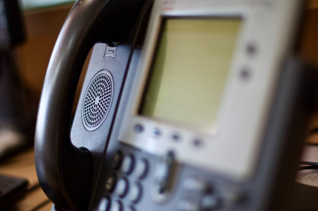 VoIP Features - close up of a digital desk telephone