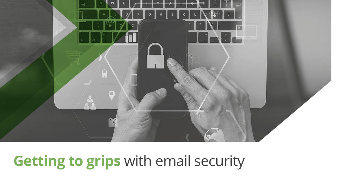 Email Protection: Getting to Grips with Email Security - graphic of man holding a mobile phone with a padlock image on it over a computer keyboard.